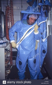 cdc-scientist-puts-on-a-protective-suit-and-face-mask-before-entering-K1F6GX.jpg