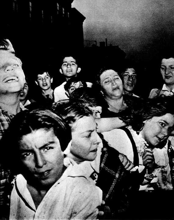 A woman relative cried . . . but neighborhood dead-end kids enjoyed the show when a small-time racketeer was shot and<br />killed . .